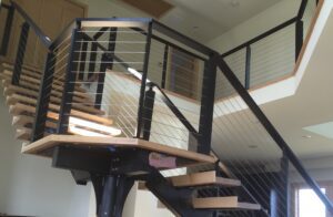 black cable railing on modern stairs