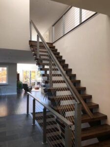 a staircase with modern railing