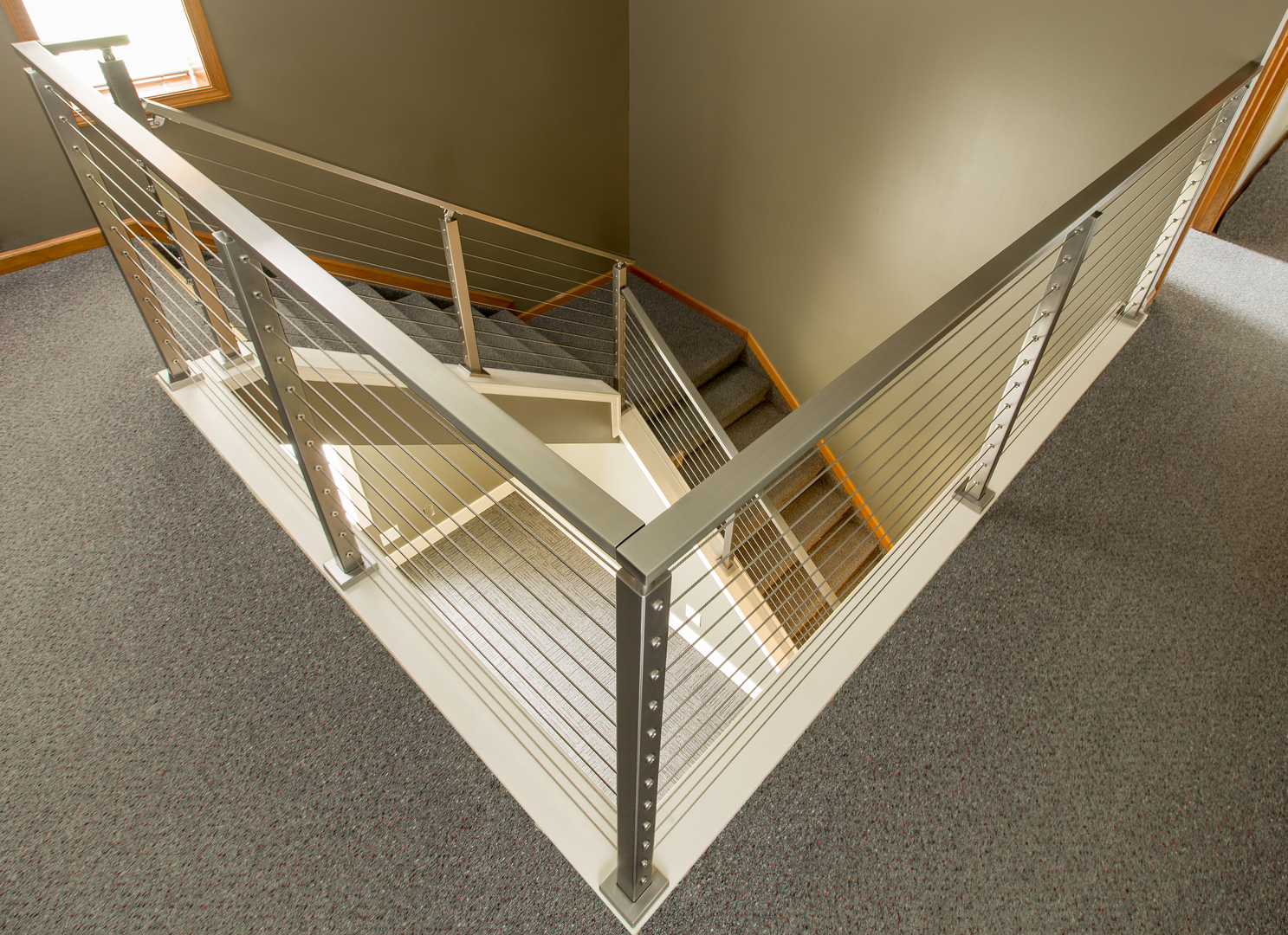 installed silver cable railings on a staircase