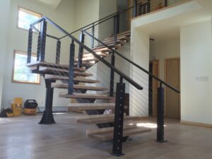 modern staircase with sleek black railing