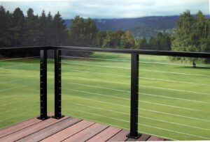 cable railing on a terrace with a view of a forest