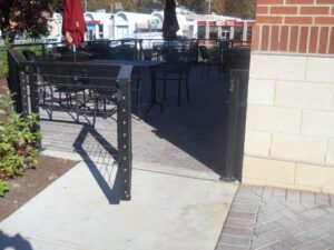 black cable railings around an outdoor dining area
